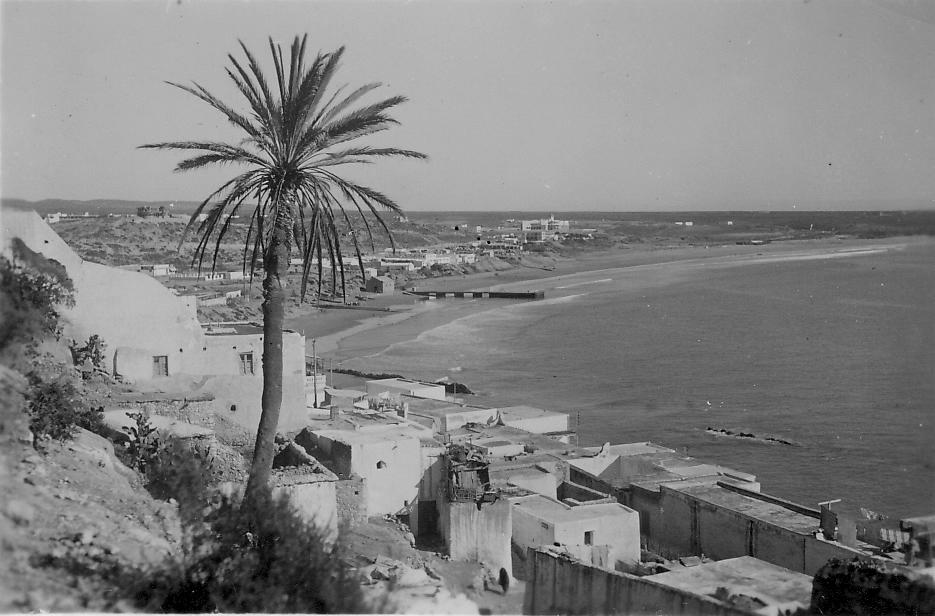 Black-and-white view from the hillside across the old Founti quarter and beach in Agadir, 1930.